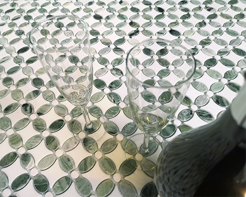 Green natural marble mosaic: the art of stone, full of greenery